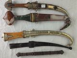 several different types of knives are lined up on a table