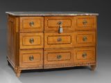 an antique chest of drawers with marble top and brass hardware