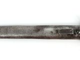an old knife with a wooden handle on a white surface