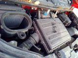 a picture of a car engine with its hood open
