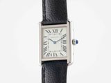 a close up of a wrist watch with roman numerals on it