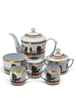 une image représentant un service à thé composé de quatre tasses et d'une théière