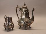 silver plated coffee pot and sugar shaker on stand