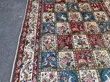an image of a large rug with a patchwork design on it