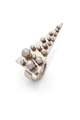 a close up of a metal object on a white surface