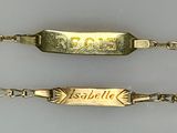 two bracelets that have a name engraved on them
