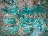 a close up picture of a cake with a name written on it