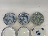 six blue and white plates with floral designs on them on a table