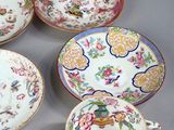 many plates and cups that are sitting on a table