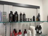 many different types of hair products displayed on the shelves