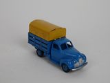a toy truck with a box on the back of it