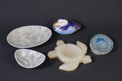 three bowls and a bowl are sitting on a black surface