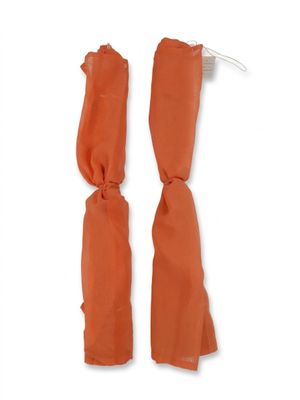 pair of orange napkins tied together on a white hanger