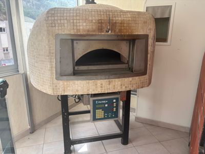 an image of a wood fired pizza oven in a kitchen
