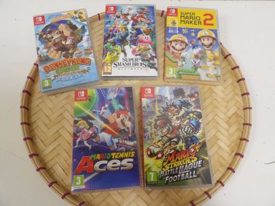 nintendo wii games on a bamboo tray on a table
