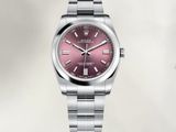 montre Rolex avec un cadran rose et un bracelet en acier inoxydable