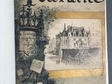 un vieux livre avec l'image d'un château en arrière-plan