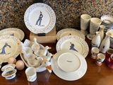 a table with many different types of china on it