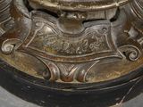 a close up of a metal object with a clock on it