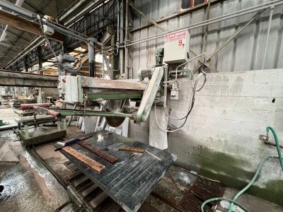 a machine that is working on a piece of wood in a factory