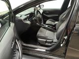 the interior of a car with the door open and the driver ' s seat down