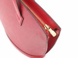 the inside of a red purse with a zipper on it