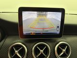 the view of a car ' s dashboard with a car ' s rear view camera