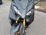 a black motorcycle parked on the side of the road
