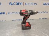 a cordless drill is sitting on top of a table