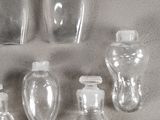 a lot of empty glass bottles sitting on a table