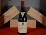 a bottle of wine that is sitting on a table