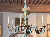 a chandelier that is hanging from the ceiling in a room