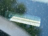 a sticker on the window of a car with a barcode on it