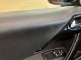 a close up of a car door handle and dash buttons
