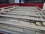 a metal bed that is in the middle of a room