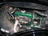 a green engine in the back of a black car