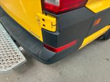 a close up of the rear end of a yellow car