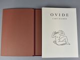 an open book with a drawing of a woman on it