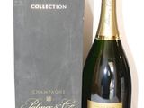 une image représentant une bouteille de champagne à côté d'une boîte