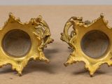 pair of antique brass candlesticks with ornate decoration
