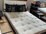 a bed that is in a room with a lot of furniture
