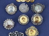 six antique brooches of women ' s portraits and brooches on a blue background