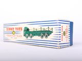 a toy truck that is sitting on a white surface