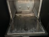 an open oven in the middle of a kitchen