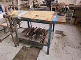an image of a workbench in a workshop with a lot of tools