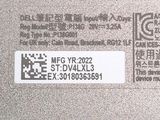 a label on the back of a laptop that says mcg yr 2022