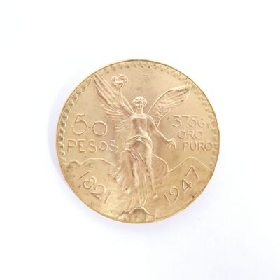 l'image d'une pièce d'or ornée d'un ange