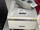 a game controller sitting on top of a stack of boxes