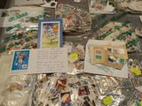 a table with a lot of stamps and postcards on it