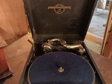 an old record player sitting in a suitcase